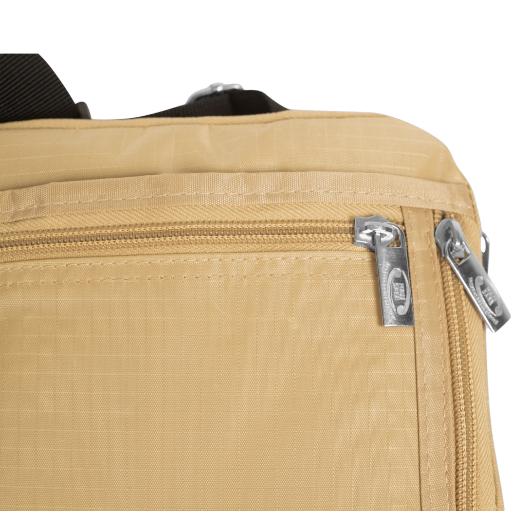 Close-up of secure zipper compartments on men's Hajj bag