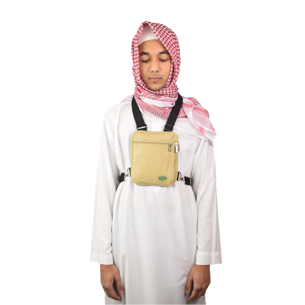 A man in a white thobe wears the beige Hajj bag for men on his chest