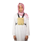 A man in a white thobe wears the beige Hajj bag for men on his chest
