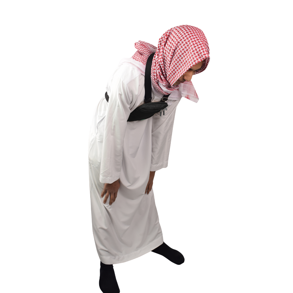 Male pilgrim wearing compact black Hajj bag during pilgrimage travel