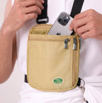 A man in white slipping a phone into the beige Hajj bag worn on his chest