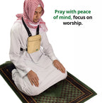 A man kneeling on a prayer mat wearing the beige Hajj bag for men