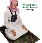Male pilgrim wearing Hajj and Umrah bag while praying (1)
