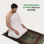 Muslim man praying in comfortable white Ihram during pilgrimage
